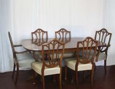   Mahogany twin pedestal center extension dining table with 4 chairs and two carver chairs         $600