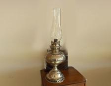 48     Paraffin Vintage table lamp. Chromed base with clear glass chimney. Complete with wick in working condition.     $90